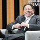 One of America's highest paid CEOs smiles at his next windfall.